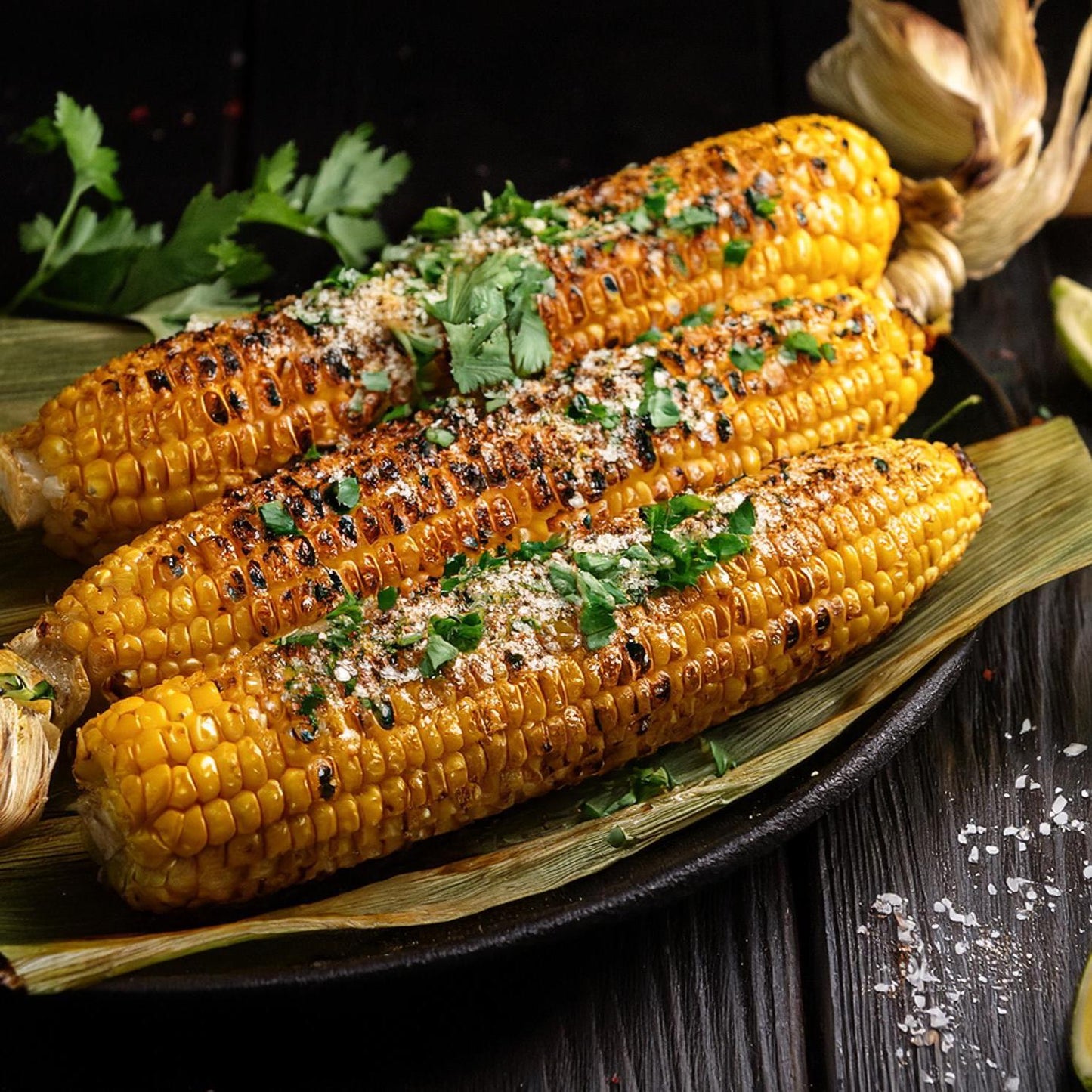 Grilled Corn on the Cob with Elote Seasoning with lemons and cilantro