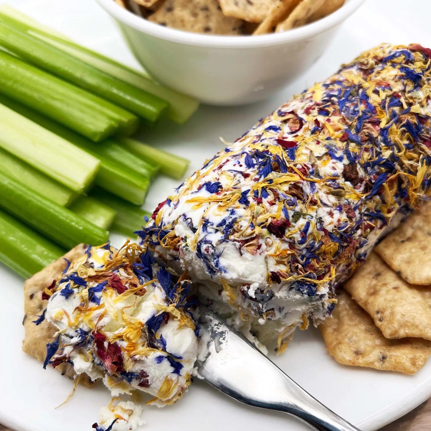 Image of Rocky Mountain Blossom and Fennel Pollen Goat Cheese with crackers and Celery