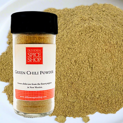 Jar of Old Town Spice Shop Green Chilli Powder with spilled powder on a white plate