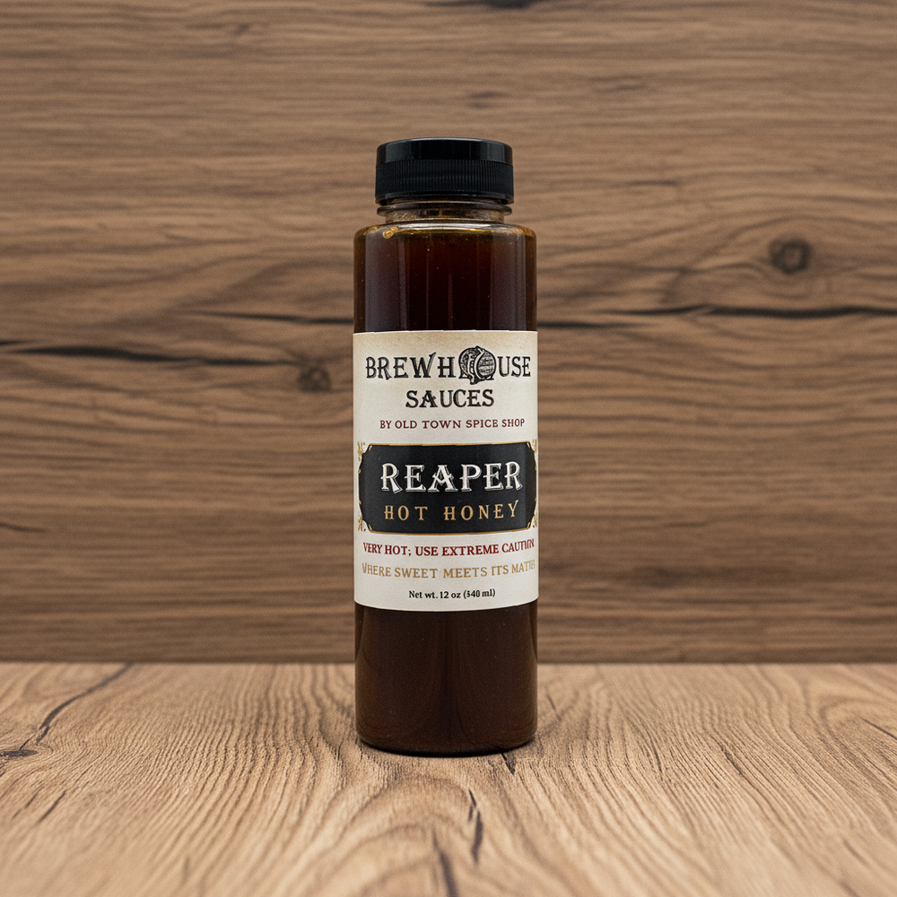 Bottle of Brew House Sauces Reaper Hot Honey on a white background