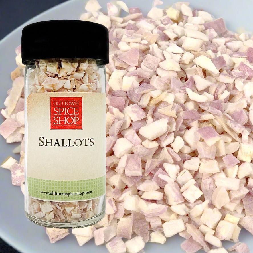 Jar of Old Town Spice Shop shallots with shallot pieces in the background
