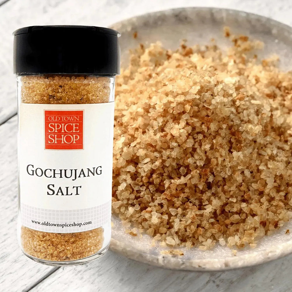 Gochujang salt container from Old Town Spice Shop with a close-up of the salt on a plate.
