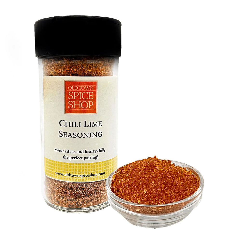 
                      
                        Jar of Old Town Spice Shop Chili Lime Seasoning with a small bowl of seasoning on a white background
                      
                    