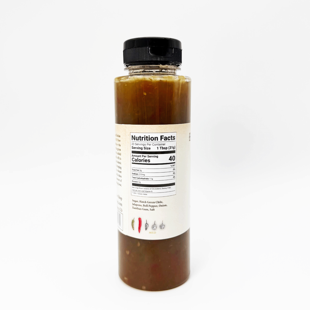 A clear plastic bottle filled with a dark reddish-brown sauce or dressing, topped with a black ribbed cap and featuring a white Nutrition Facts label on the side, photographed against a plain white background.