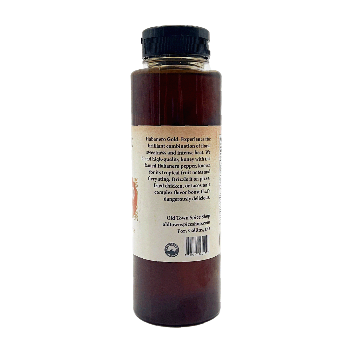 Bottle of Habanero Gold sauce with a label on a white background