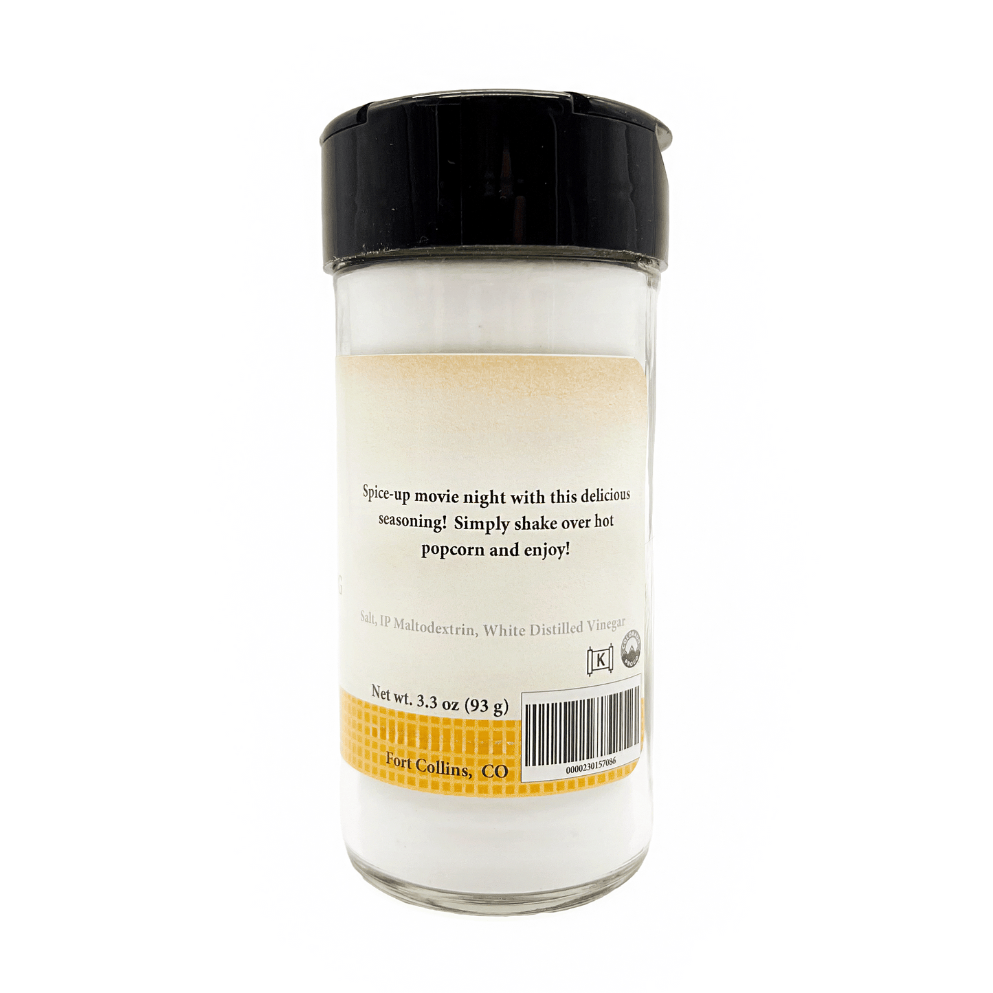 Glass seasoning shaker with black lid on a white background