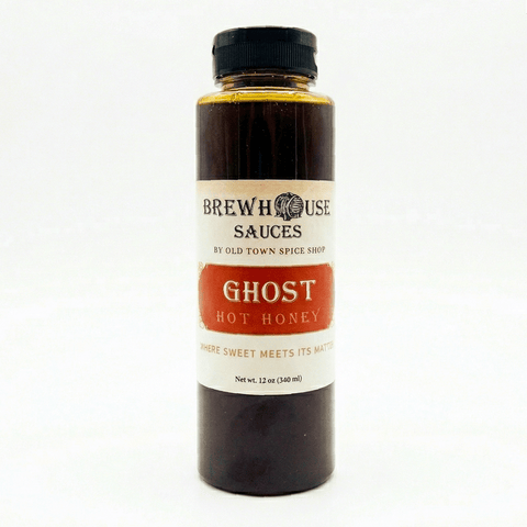Bottle of Brewhouse Sauces Ghost Hot Honey on a white background