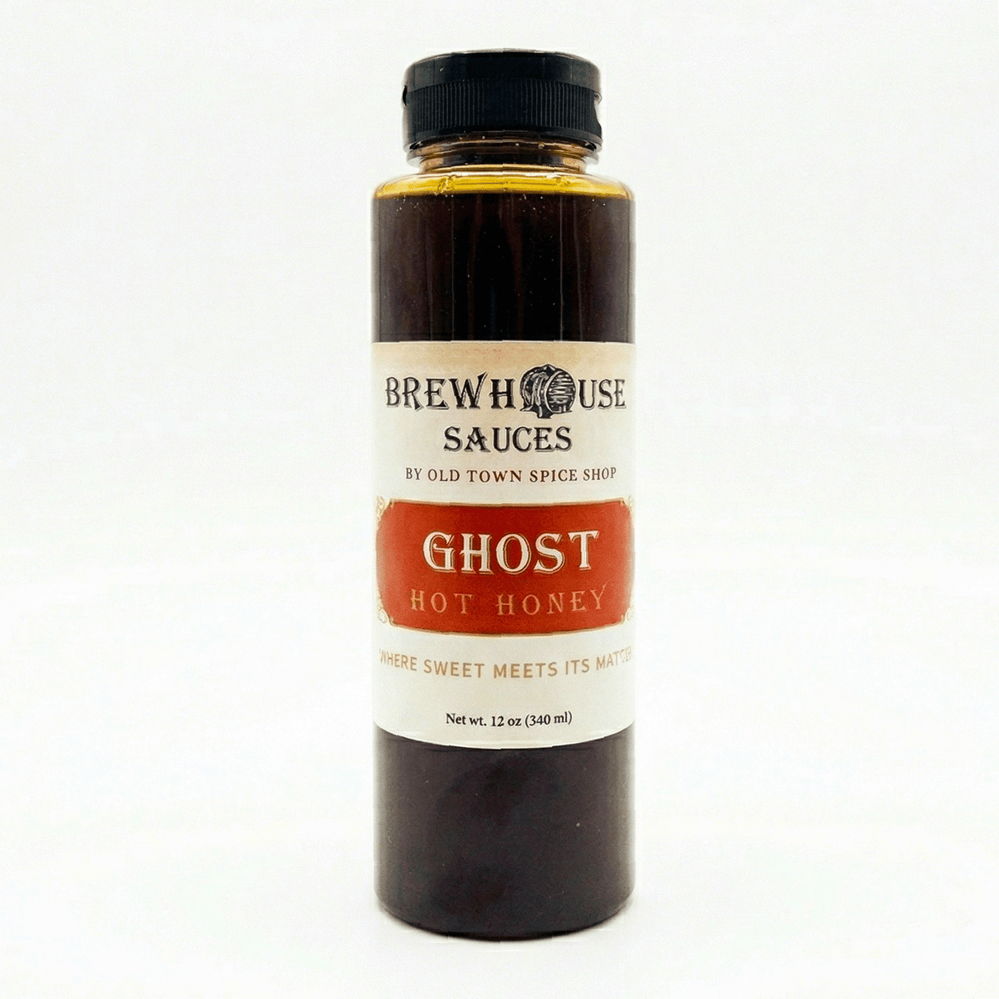 Bottle of Brewhouse Sauces Ghost Hot Honey on a white background
