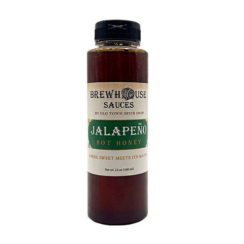 Bottle of BrewHouse Sauces Jalapeño Hot Honey on a white background