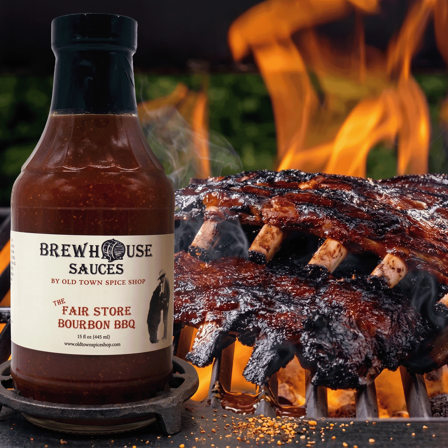 Bottle of Brewhouse Sauces Fair Store Bourbon BBQ with ribs on a grill