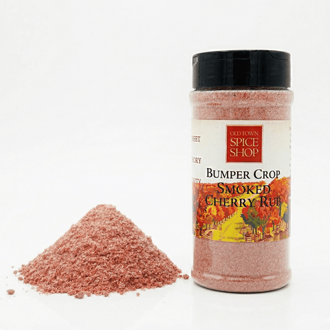 Bottle of Old Town Spice Shop Bumper Crop Smoked Cherry Rub with a pile of the product on a white background