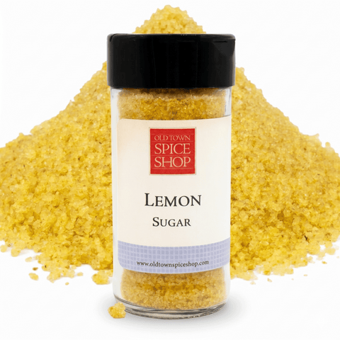 lemon sugar in jar in front of pile of sugar