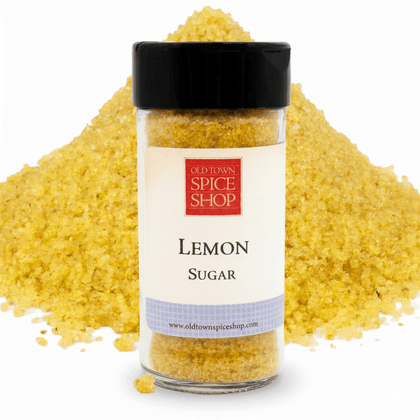 lemon sugar in jar in front of pile of sugar