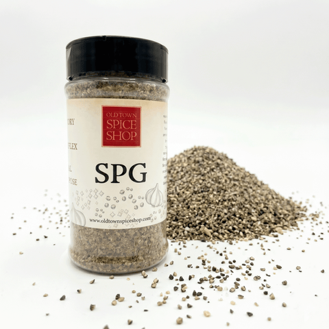 Spice jar labeled 'SPG' from Old Town Spice Shop with pepper on a white background