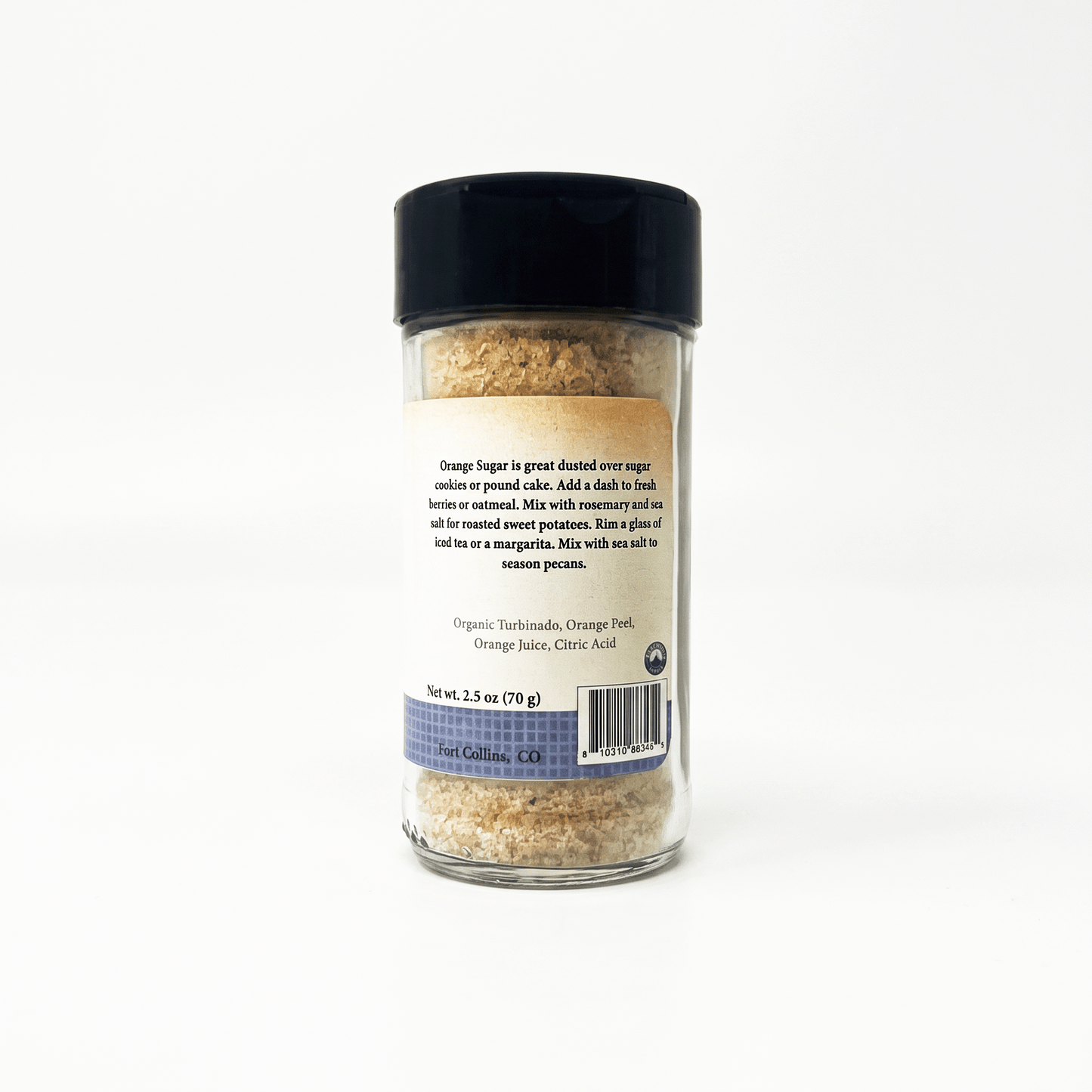 A clear plastic spice jar filled with coarse brown seasoning, featuring a black lid and a beige paper label showing product details, photographed against a plain white background.