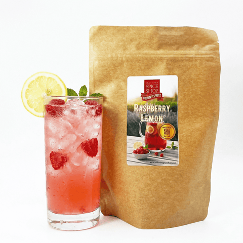 drink with raspberry  and lemon with a kraft bag showing the product raspberry lemon country spritz