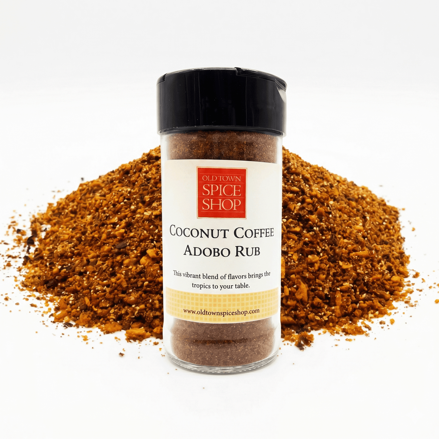 Jar of Old Town Spice Shop Coconut Coffee Adobo Rub with scattered spice on a white background
