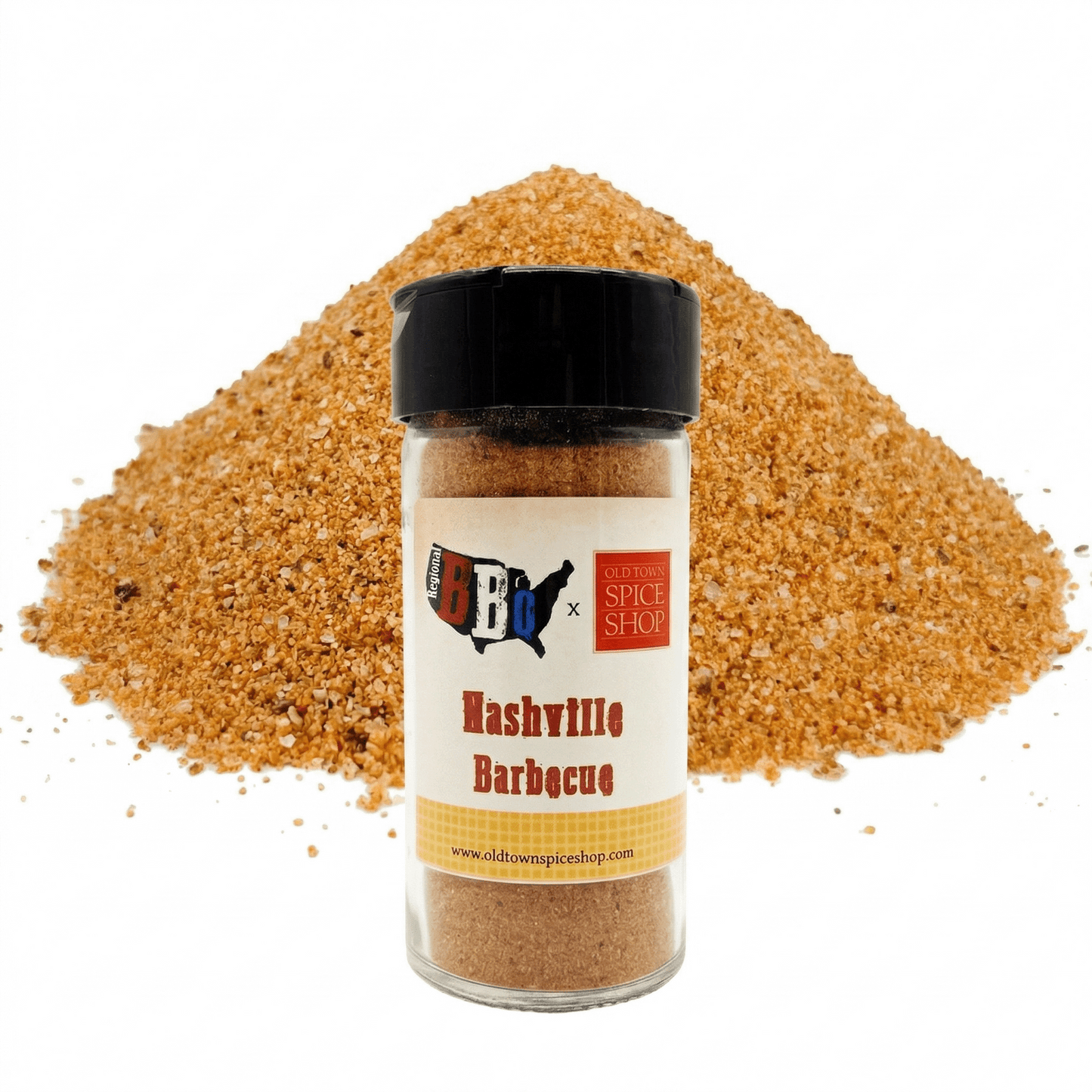 Bottle of Nashville Barbecue spice blend with a pile of brown spice on a white background