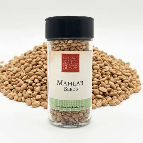 Jar of Mahlab seeds with a visible label on a white background