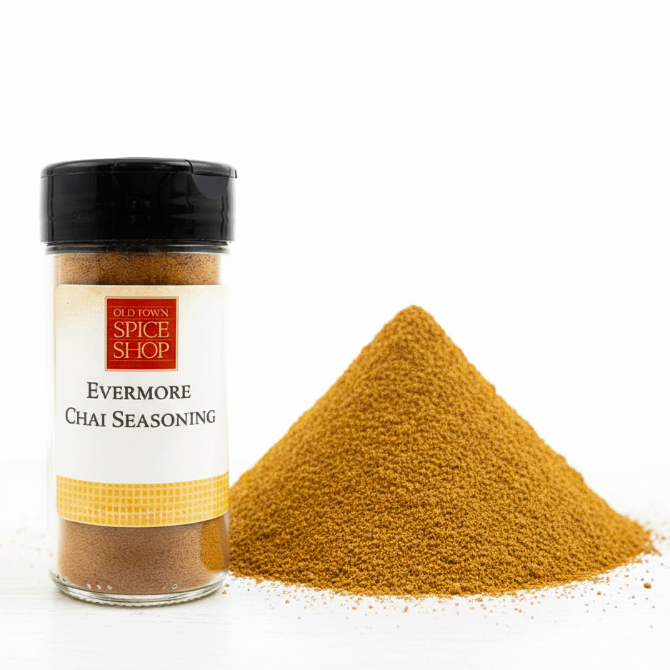 Bottle of Old Town Spice Shop Evermore Chai Seasoning with a pile of the seasoning on a white background