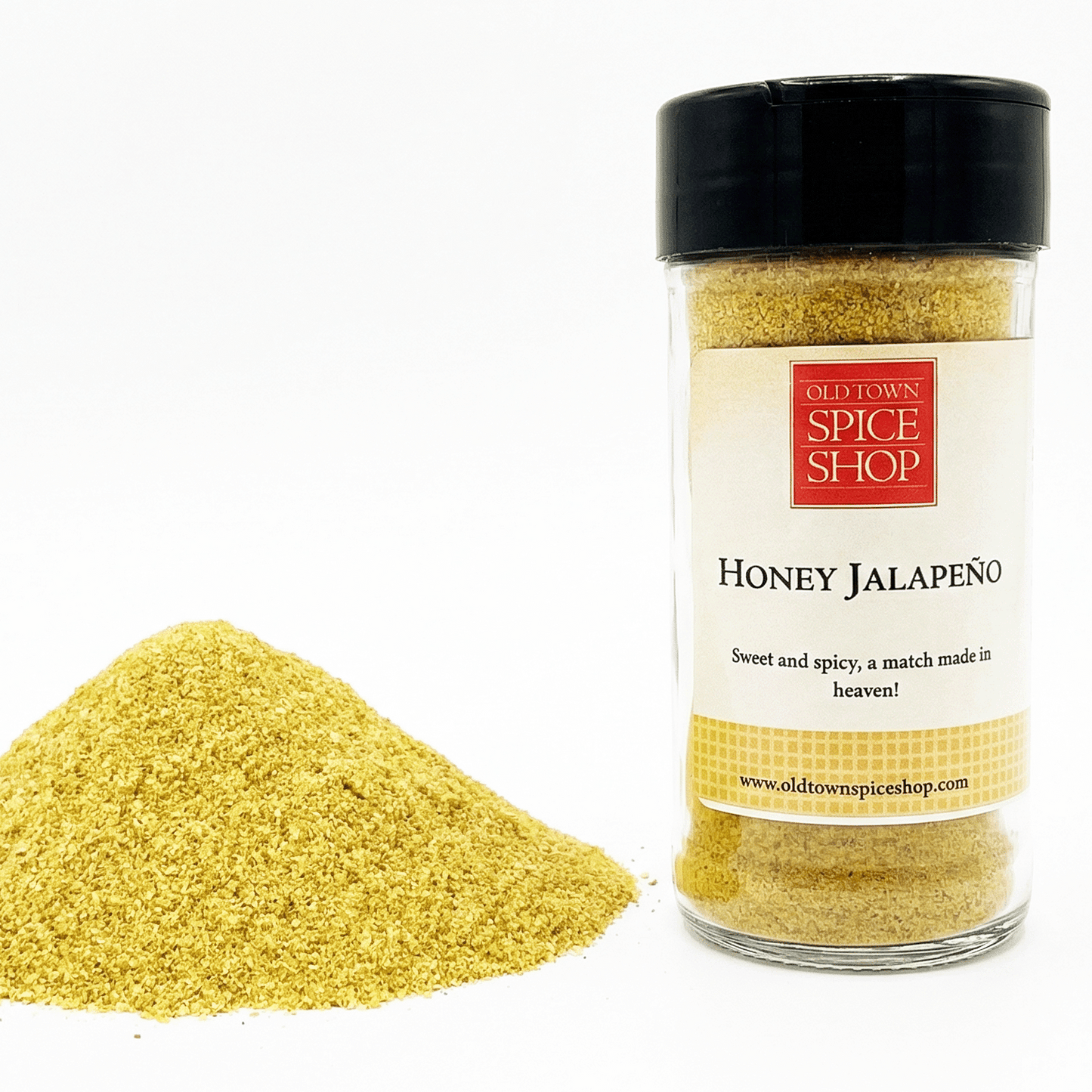 Jar of Old Town Spice Shop Honey Jalapeno spice blend with spilled spice on a white background