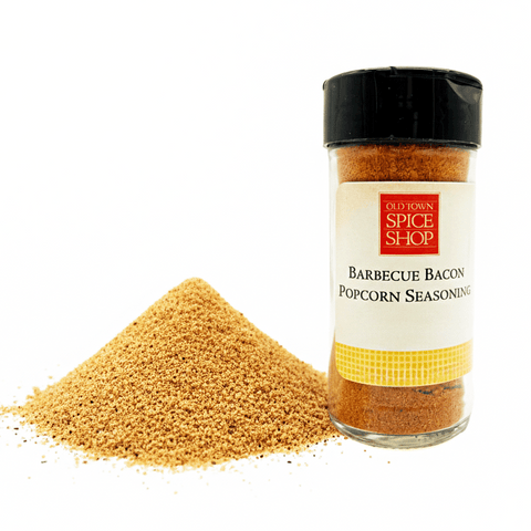 Barbecue Bacon Popcorn Seasoning container from Old Town Spice Shop with spilled seasoning on a white background