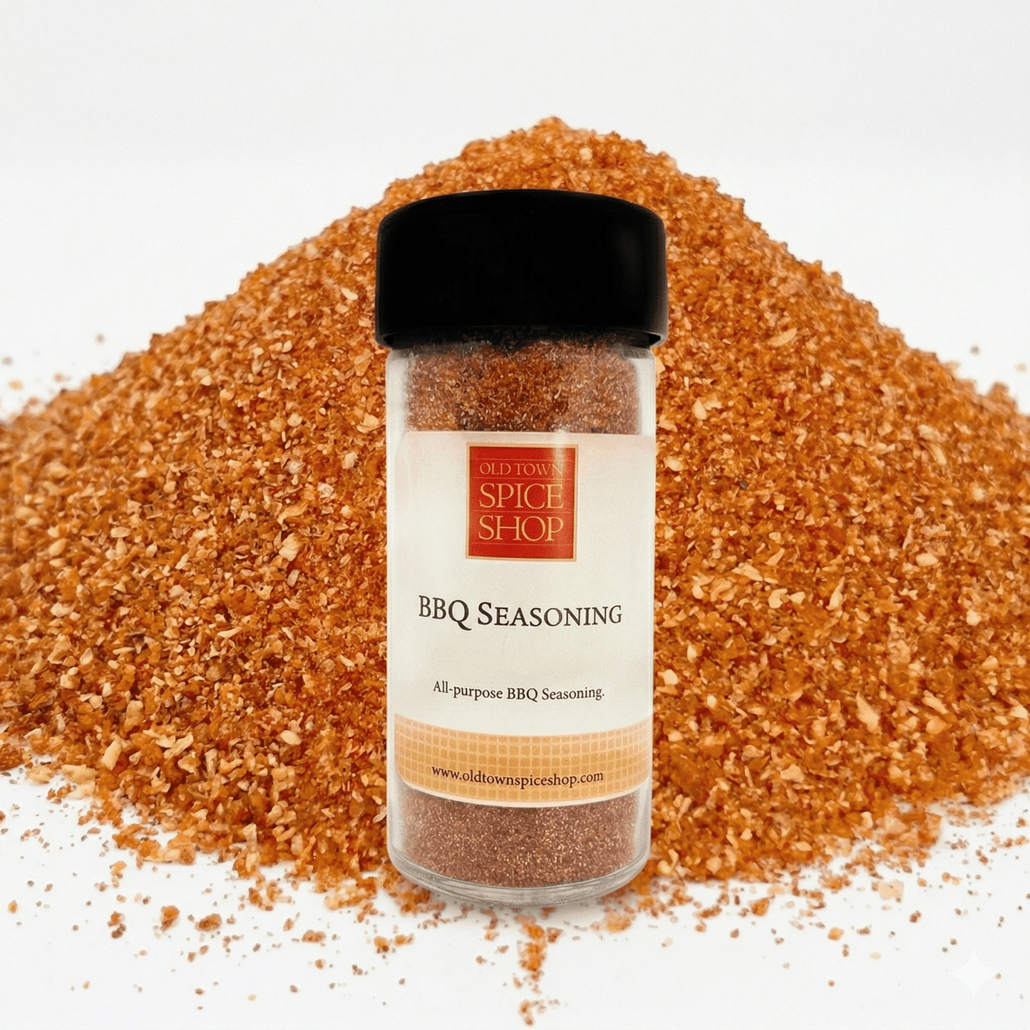 BBQ seasoning jar with a pile of seasoning in the background