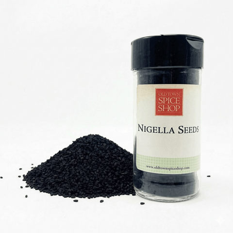 Jar of Nigella Seeds from Old Town Spice Shop with black seeds on a white background