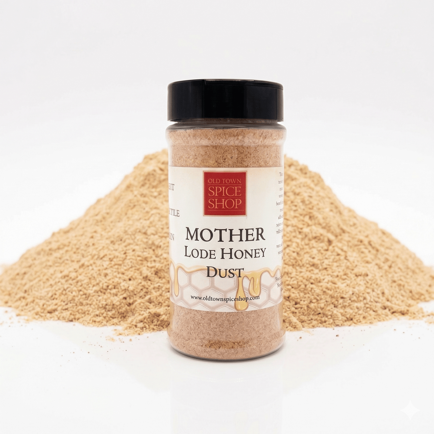 Mother lode honey dust jar in front of spices