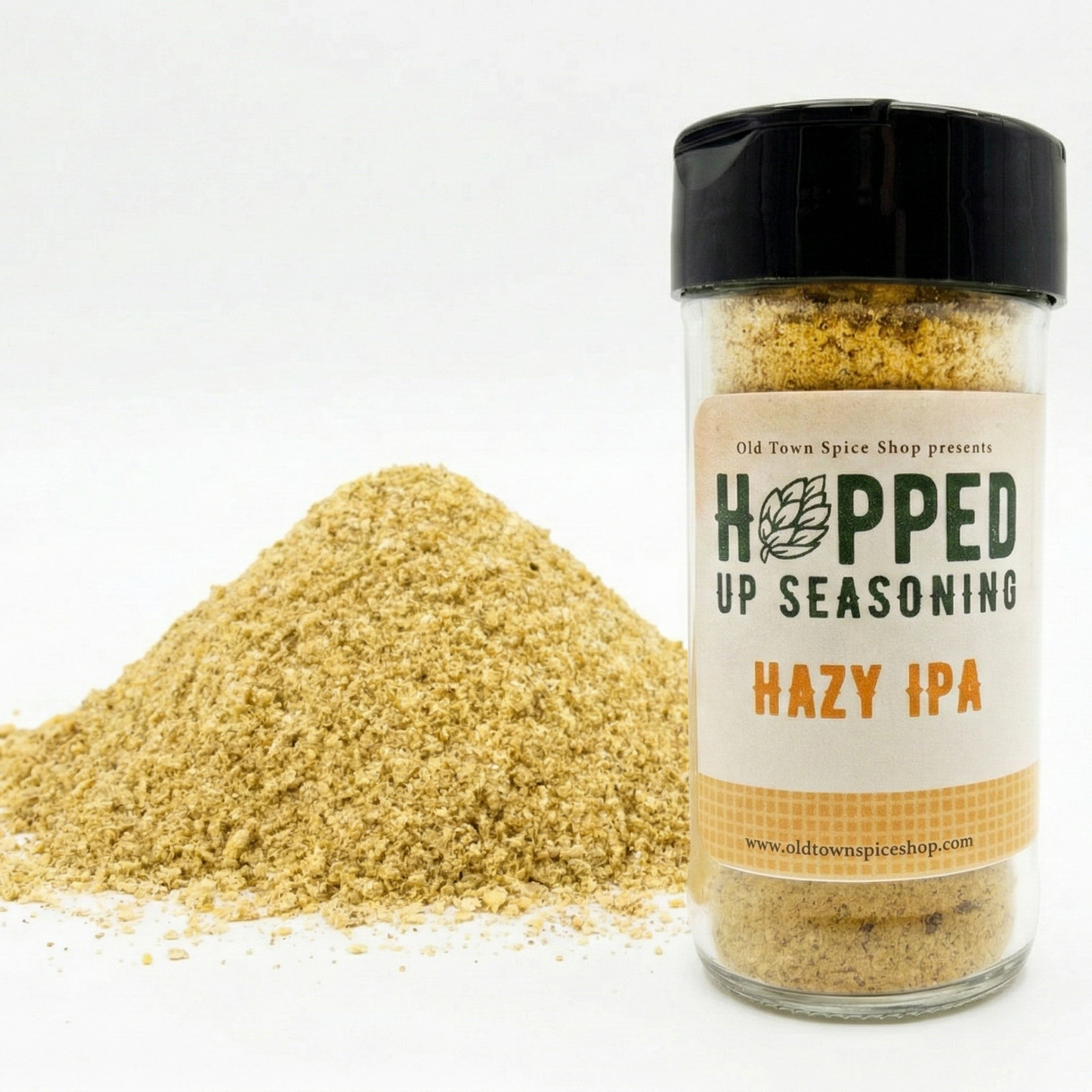 Jar of 'Hopped Up Seasoning Hazy IPA' with a pile of seasoning on a white background