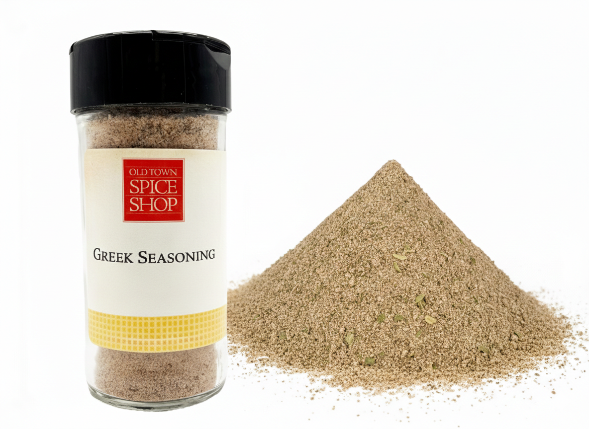 Jar of Old Town Spice Shop Greek Seasoning with spilled seasoning on a white background