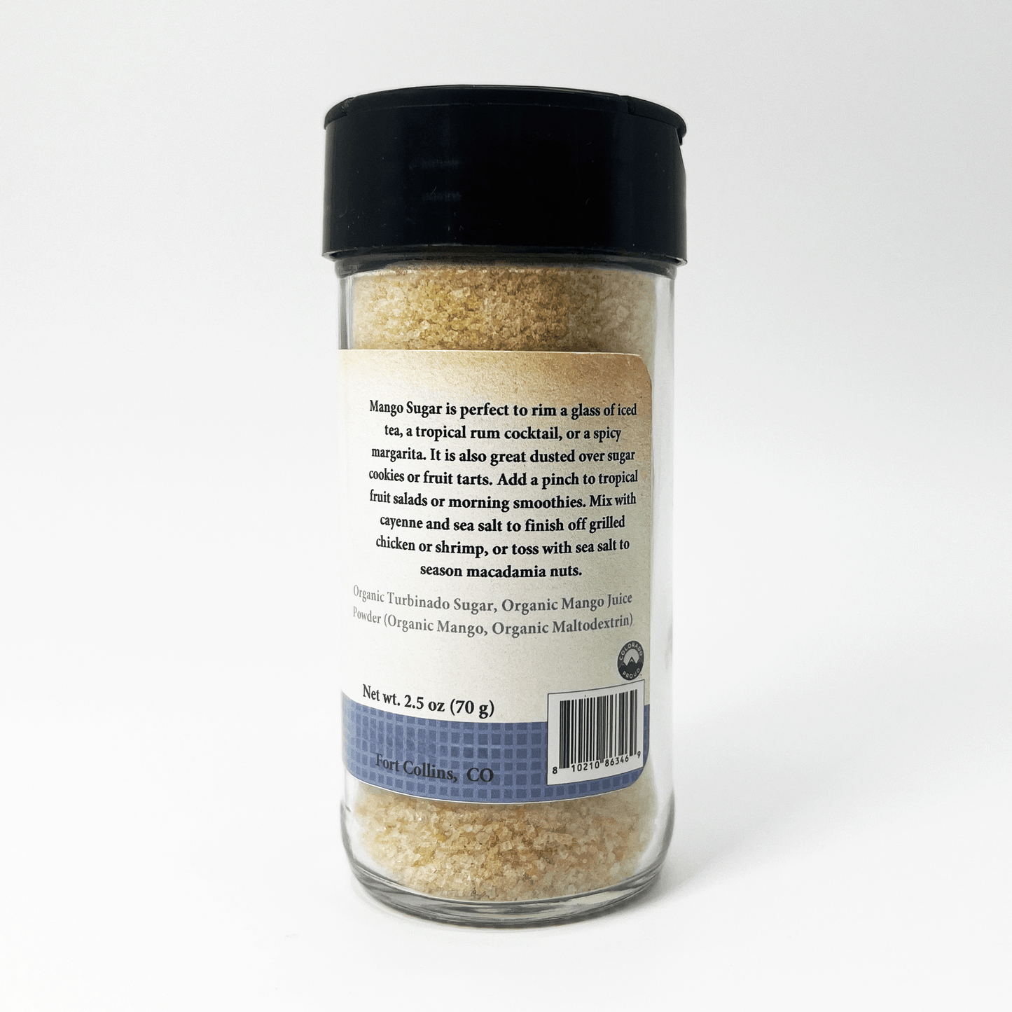 A clear plastic bottle of organic mango sugar with a black lid and a white label showing the back text, set against a clean white background.