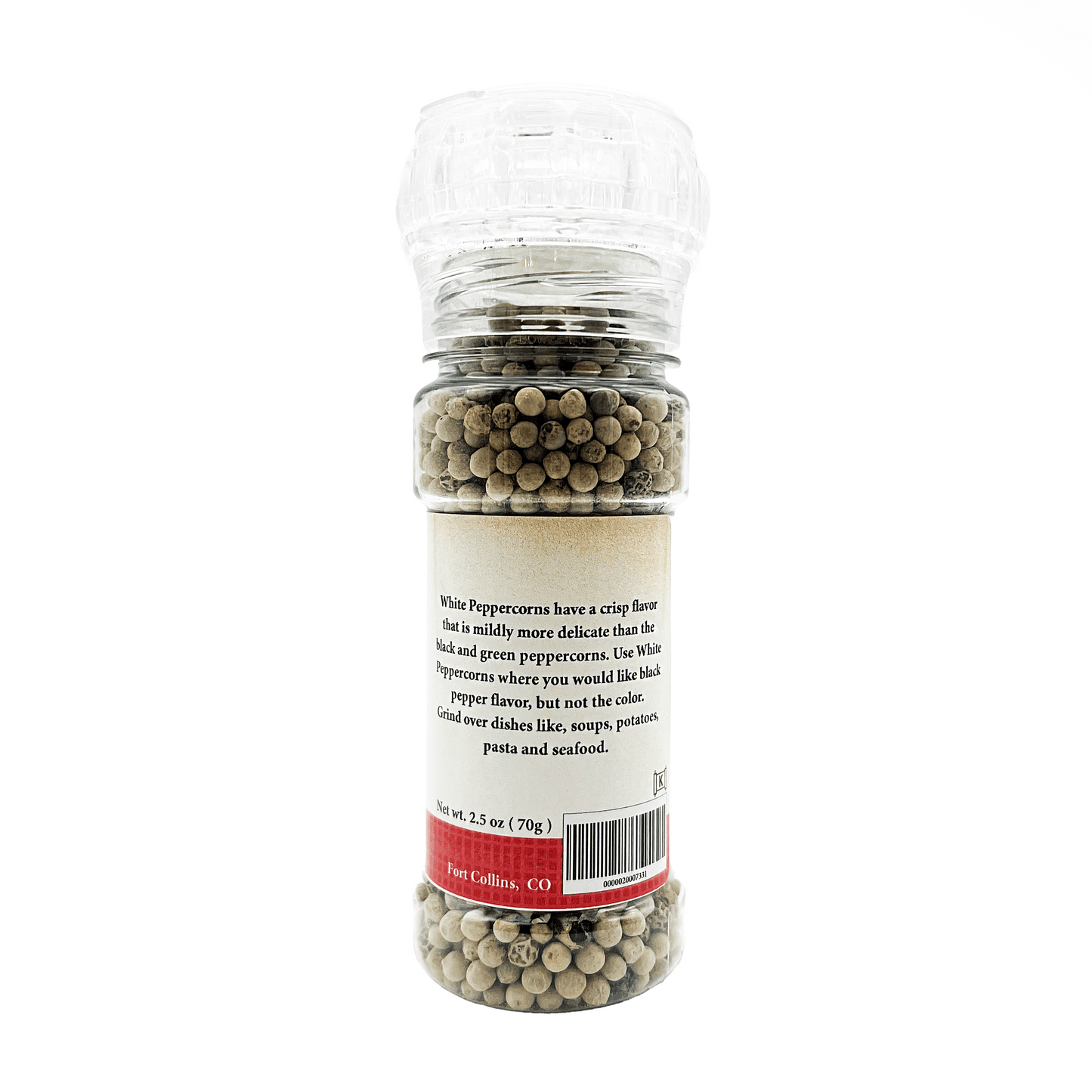 Bottle of white peppercorns with a label on a white background