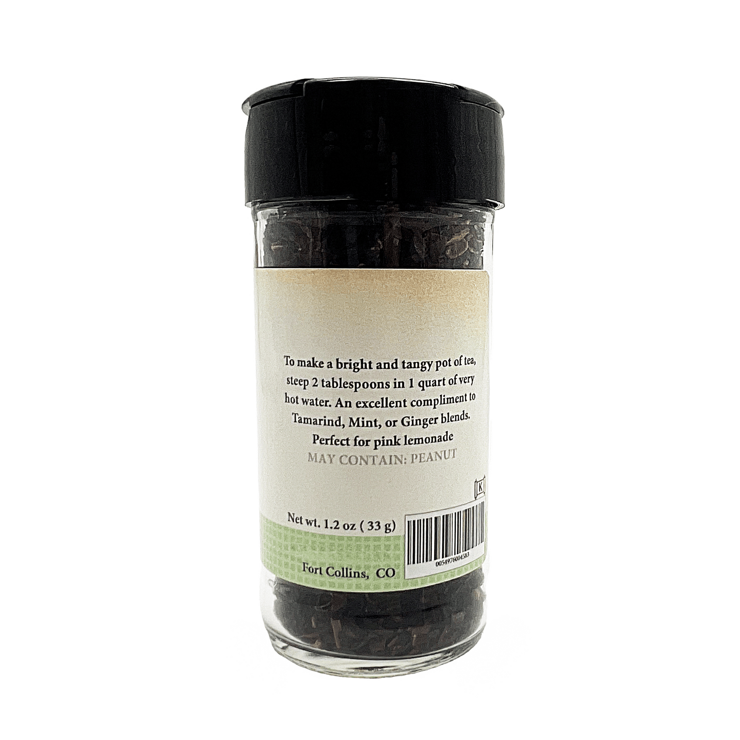 Glass jar with black lid containing tea leaves, labeled on a white background