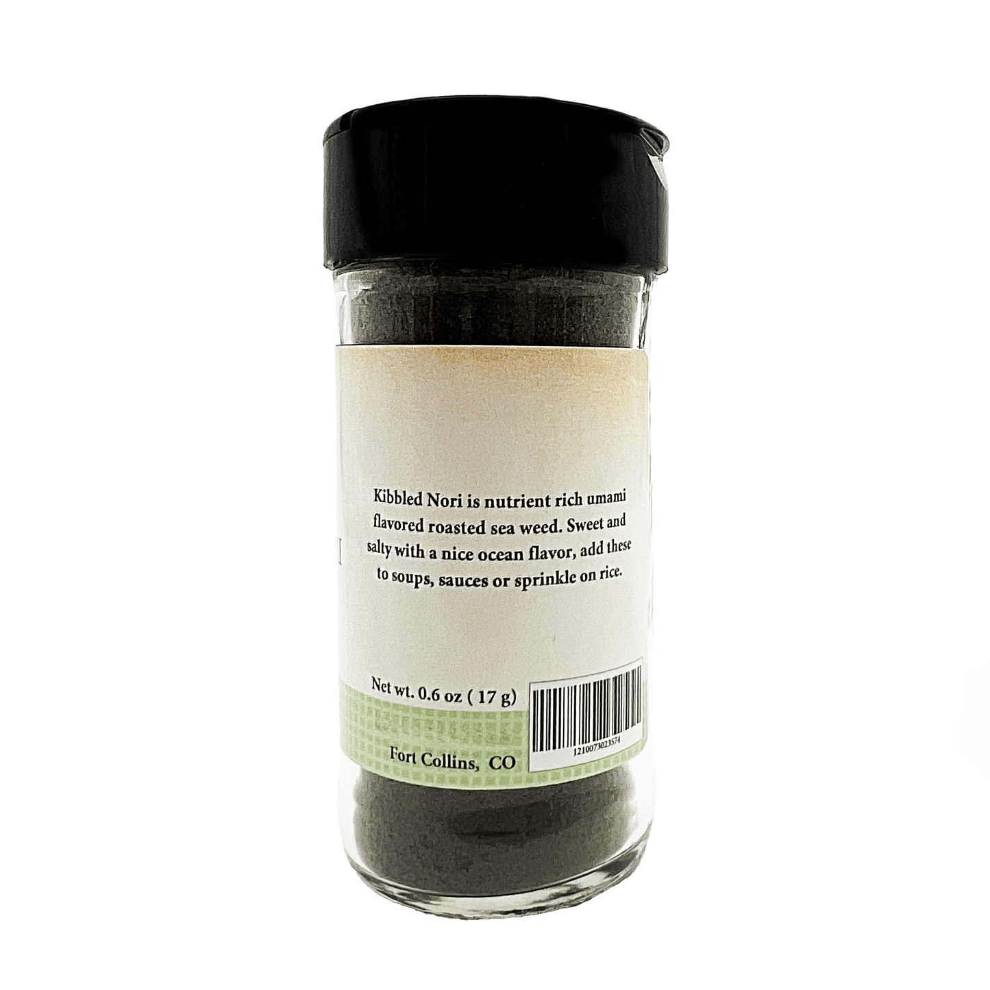 Glass container of kibbled nori with a black lid on a white background