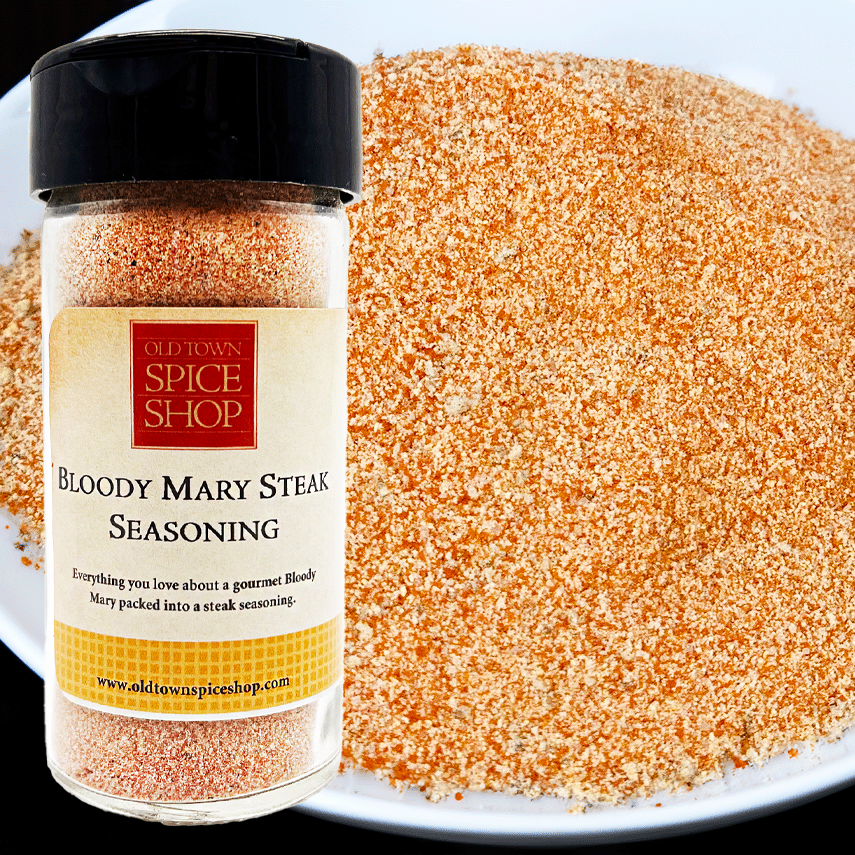 Jar of Old Town Spice Shop Bloody Mary Steak Seasoning with seasoning on a plate.