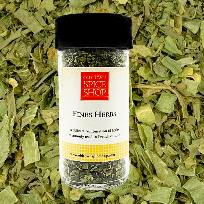 Jar of Old Town Spice Shop Fines Herbs on a bed of dried herbs