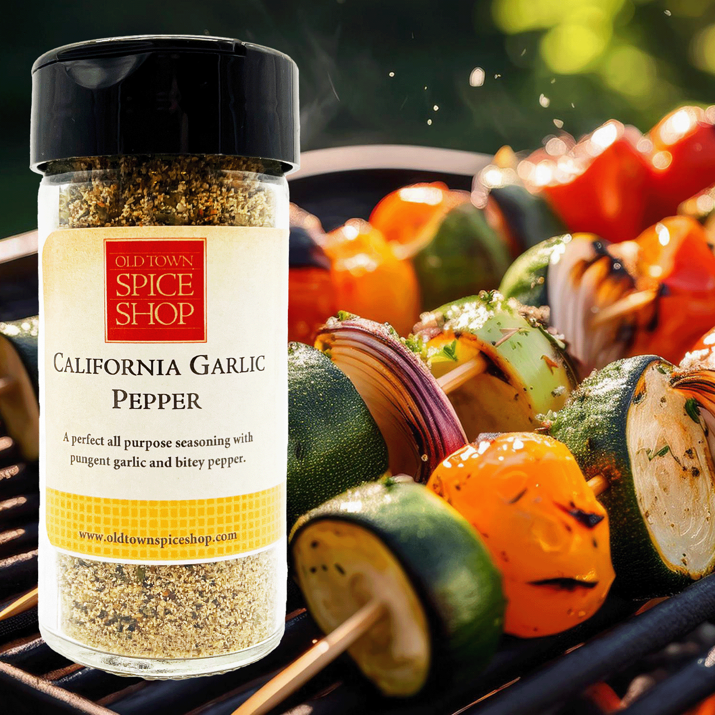Bottle of Old Town Spice Shop California Garlic Pepper on a grill with skewered vegetables.