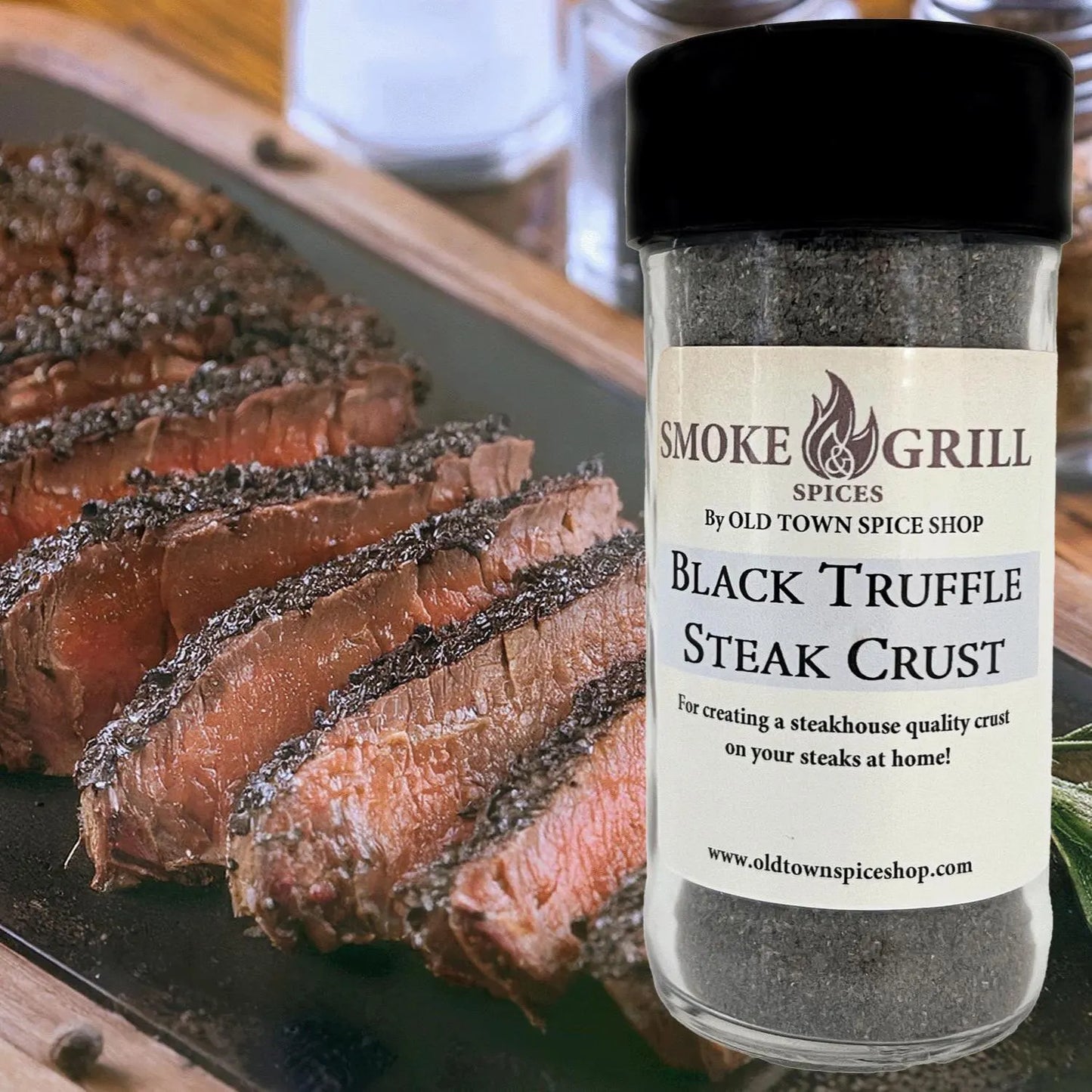 Jar of Smoke & Grill Black Truffle Steak Crust spice mix with cooked steak in the background.